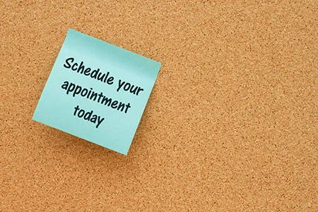 bulletin board with schedule your appointment note 