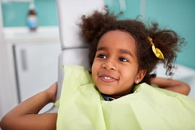 smiling girl at dental office